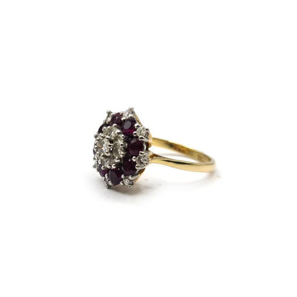 18ct yellow gold ring with 0.25 carat ruby and 0.90 carat diamond, featuring a classic design and sparkling gemstones.