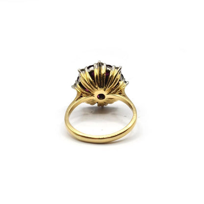 18ct yellow gold ring featuring a 0.25 carat ruby and 0.90 carat diamond, showcasing a classic and elegant jewelry design