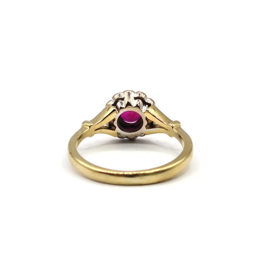 18ct yellow gold ring with 0.33 carat ruby and 1/4 carat diamond, featuring a detailed and elegant design.
