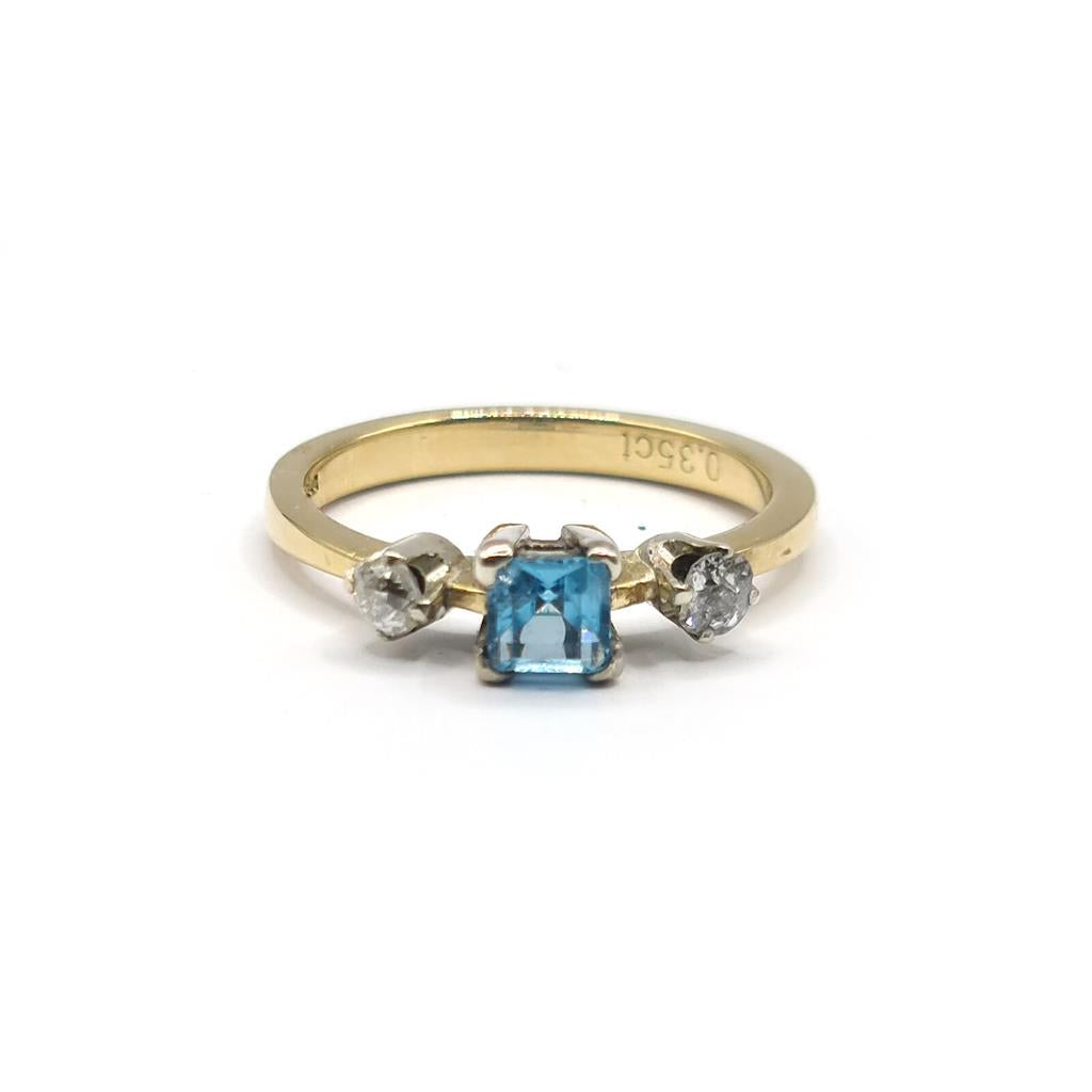 18ct yellow gold ring featuring a 0.35 carat topaz and 0.14 carat diamond accents, elegant jewelry piece.