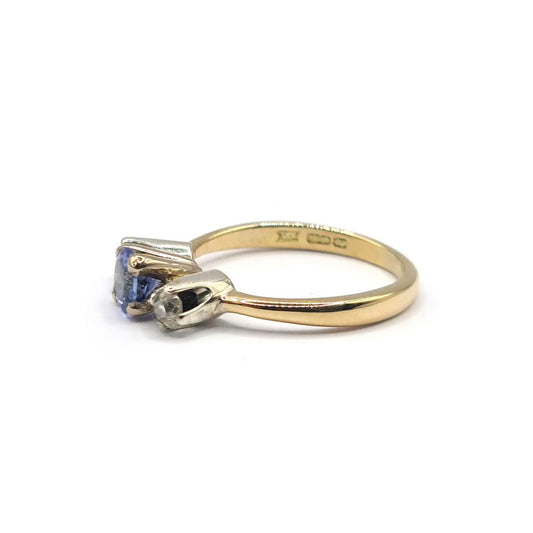 18ct yellow gold ring with a 0.40 carat tanzanite gemstone and 0.20 carat diamonds, showcasing elegant jewelry design.