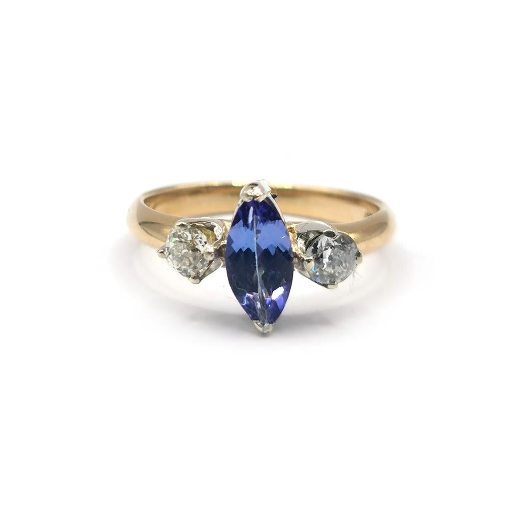 18ct yellow gold ring with a 0.50 carat tanzanite and 0.30 carat diamond accents, featuring a sleek, elegant design.