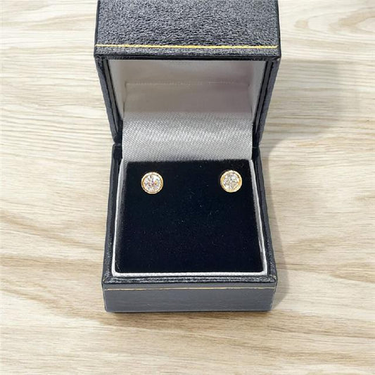 18ct yellow gold lab diamond earrings with 0.84ct total weight, color E, VS1 clarity, featuring sparkling diamonds.