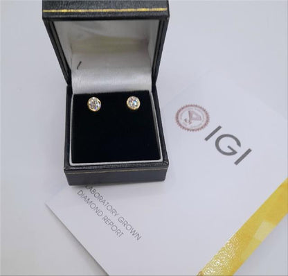 18ct yellow gold lab diamond earrings with 0.84ct, color E, VS1 clarity, featuring sparkling diamonds and a classic design.