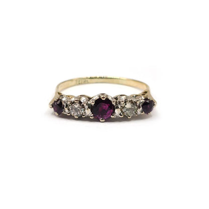 18ct yellow gold ring with 0.85 carat ruby and 0.44 carat diamond accents, elegant jewelry featuring vibrant gemstones.