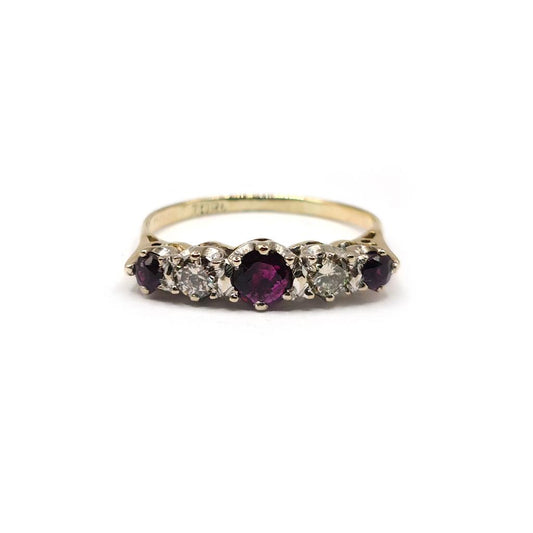 18ct yellow gold ring with 0.85 carat ruby and 0.44 carat diamond accents, elegant jewelry featuring vibrant gemstones.
