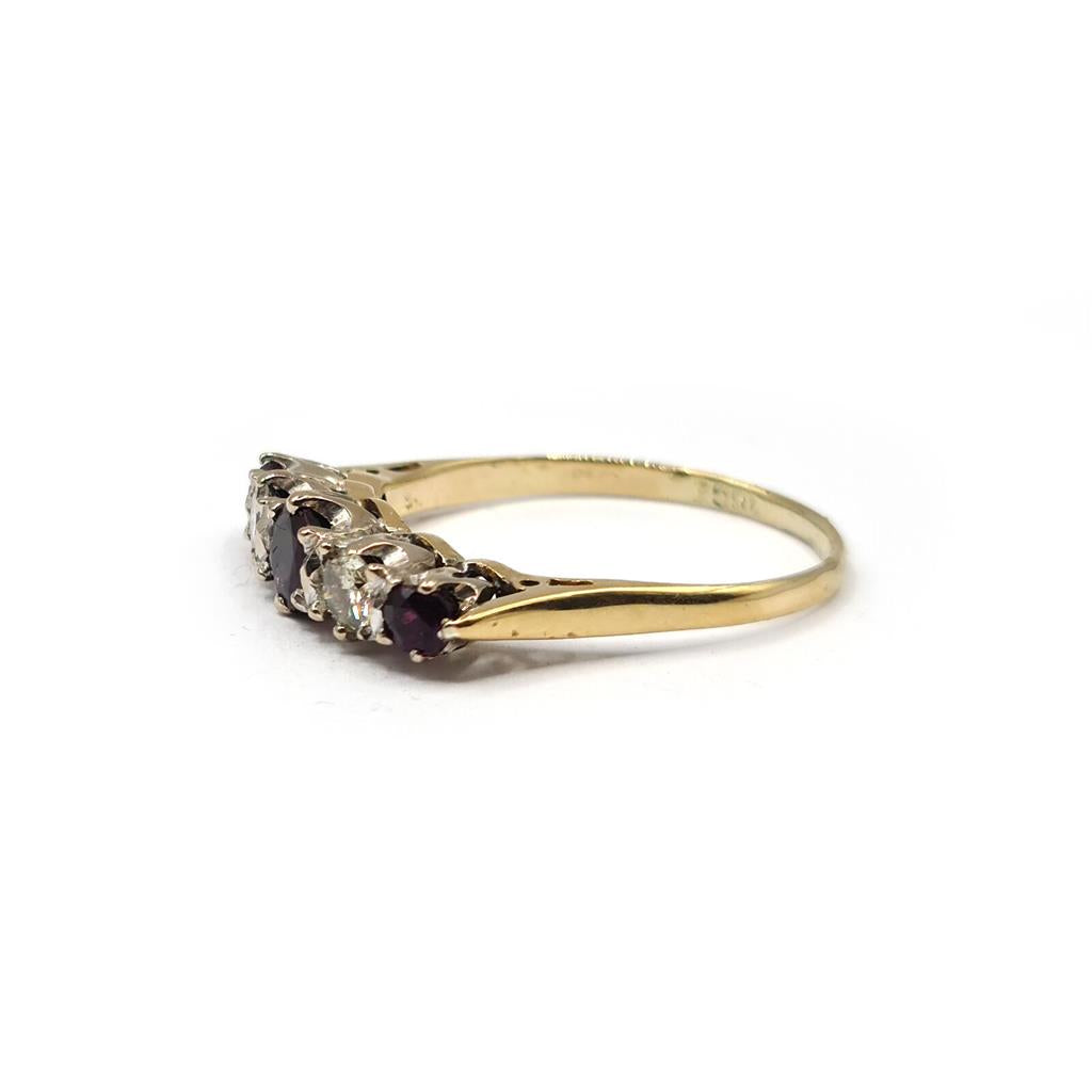 18ct yellow gold ring featuring a 0.85 carat ruby and 0.44 carat diamond, elegant jewelry piece with intricate design.