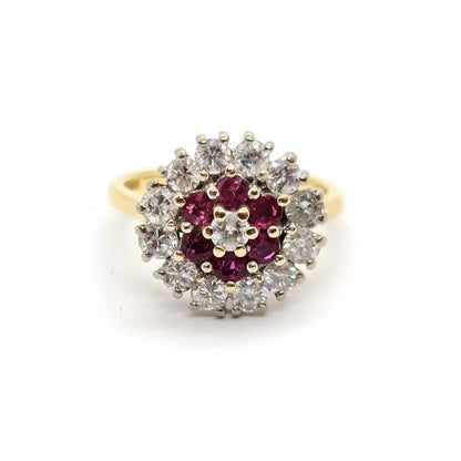 18ct yellow gold ring featuring 1.18ct diamonds and 0.36ct rubies, size K, elegant jewelry piece with gemstone accents.