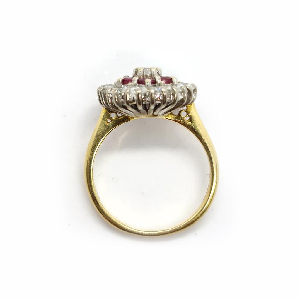 18ct yellow gold ring featuring 1.18ct diamond and 0.36ct ruby, size K, elegant jewelry piece with intricate design.