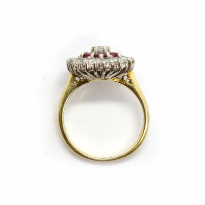18ct yellow gold ring featuring 1.18ct diamond and 0.36ct ruby, size K, elegant jewelry piece with intricate design.