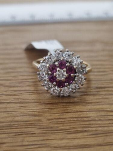 18ct yellow gold ring with 1.18ct diamond and 0.36ct ruby, size K, featuring a luxurious gemstone design.
