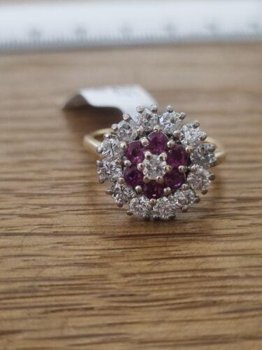 18ct yellow gold ring with 1.18ct diamond and 0.36ct ruby, size K, featuring a classic and elegant design.