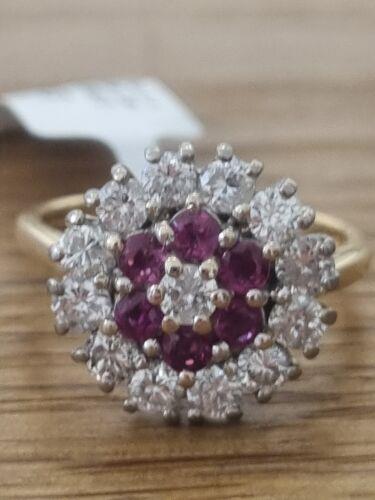 18ct yellow gold ring featuring 1.18ct diamonds and 0.36ct rubies, size K, elegant jewelry with sparkling gemstones.