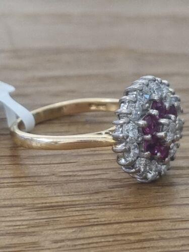 18ct yellow gold ring with 1.18ct diamond and 0.36ct ruby, size K, featuring a classic and elegant design.