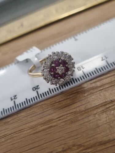 18ct yellow gold ring with 1.18ct diamonds and 0.36ct rubies in size K, showcasing a luxurious jewelry design.