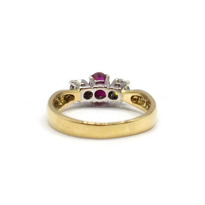 18ct yellow gold ring featuring a half-carat ruby and 0.30 carat diamonds, elegant jewelry piece.
