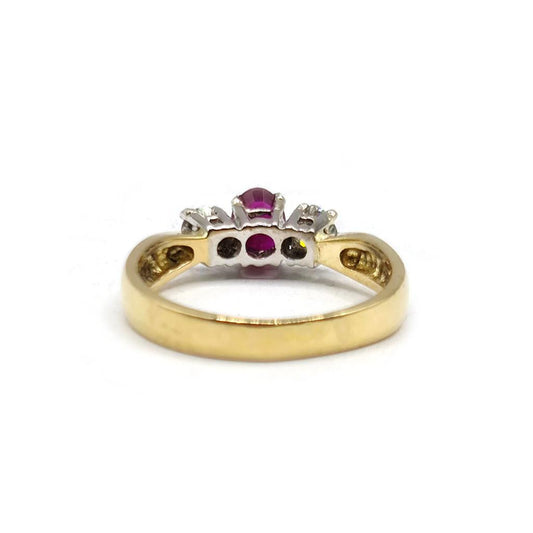 18ct yellow gold ring featuring a half-carat ruby and 0.30 carat diamonds, elegant jewelry piece.