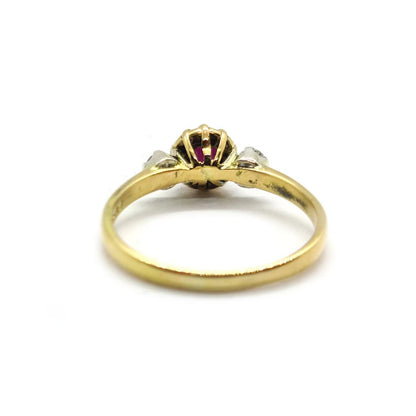 18ct yellow gold ring with a 1.45 carat garnet and 0.30 carat diamond accents, showcasing an elegant jewelry design.