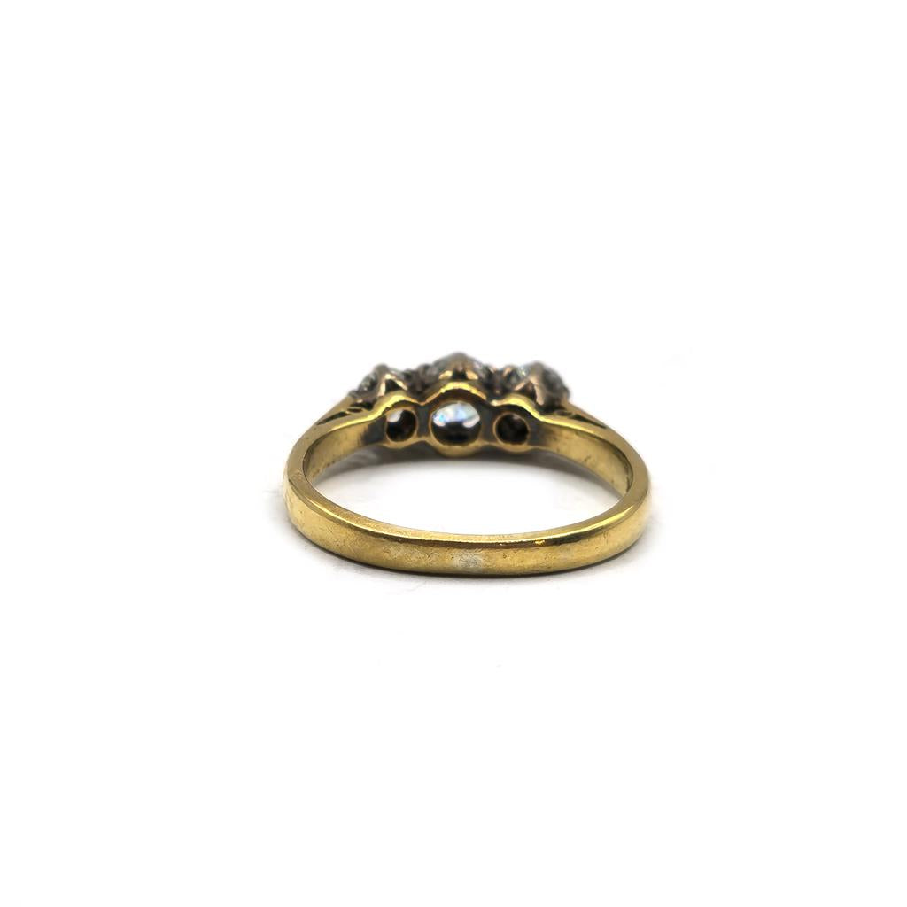 18ct yellow gold ring with three diamonds in size K, featuring a simple and elegant design.