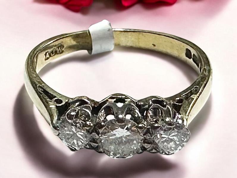 18ct yellow gold ring with three diamonds, size K, featuring a classic and elegant design.