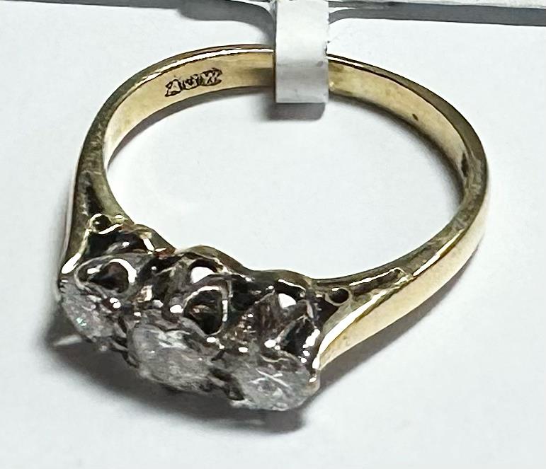 18ct yellow gold ring with three diamonds, size K, unbranded jewelry, showcasing a sleek and elegant design.