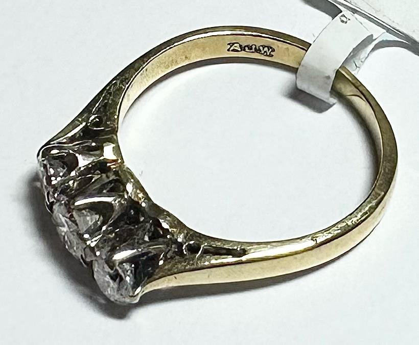 18ct yellow gold ring with three diamonds, size K, featuring a sleek design and sparkling gemstone details.