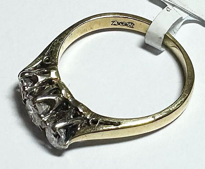 18ct yellow gold ring with three diamonds, size K, featuring a sleek design and sparkling gemstone details.