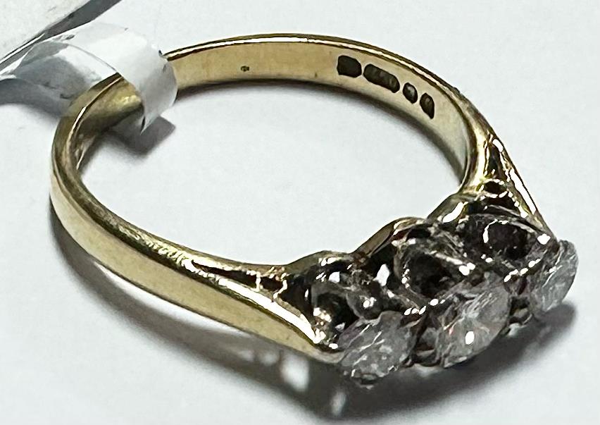18ct yellow gold ring with three diamonds, size K, showcasing a elegant and classic design.
