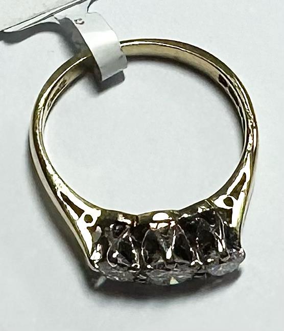 18ct yellow gold ring with three diamonds, size K, featuring elegant design and sparkling gemstones.