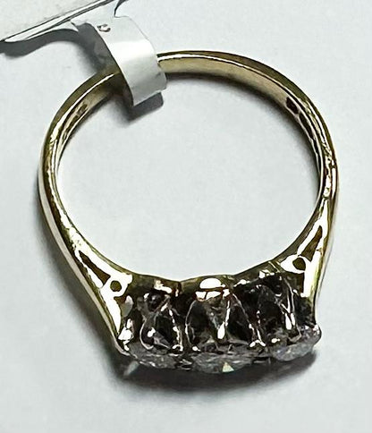 18ct yellow gold ring with three diamonds, size K, featuring elegant design and sparkling gemstones.