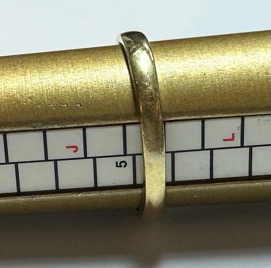 18ct yellow gold ring with three diamonds, size K, featuring a sleek design and sparkling gemstones.