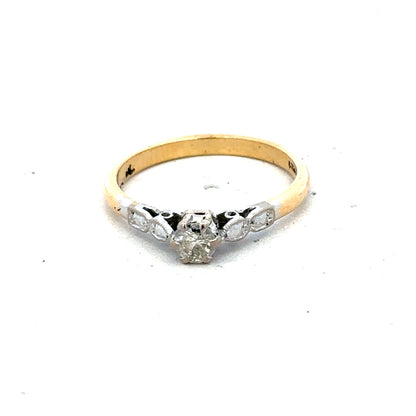 18ct yellow gold and platinum diamond ring, size M, featuring sparkling diamonds and a sleek band design.