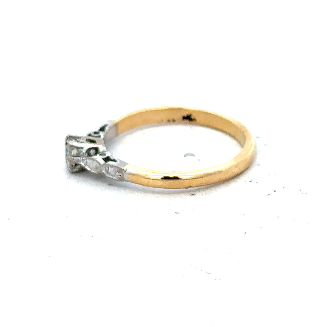 18ct yellow gold and platinum diamond ring in size M, showcasing a sparkling diamond setting on a sleek band.