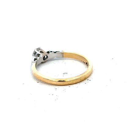 18ct yellow gold and platinum diamond ring in size M with a sleek band and sparkling diamonds, weighs 2.6g.