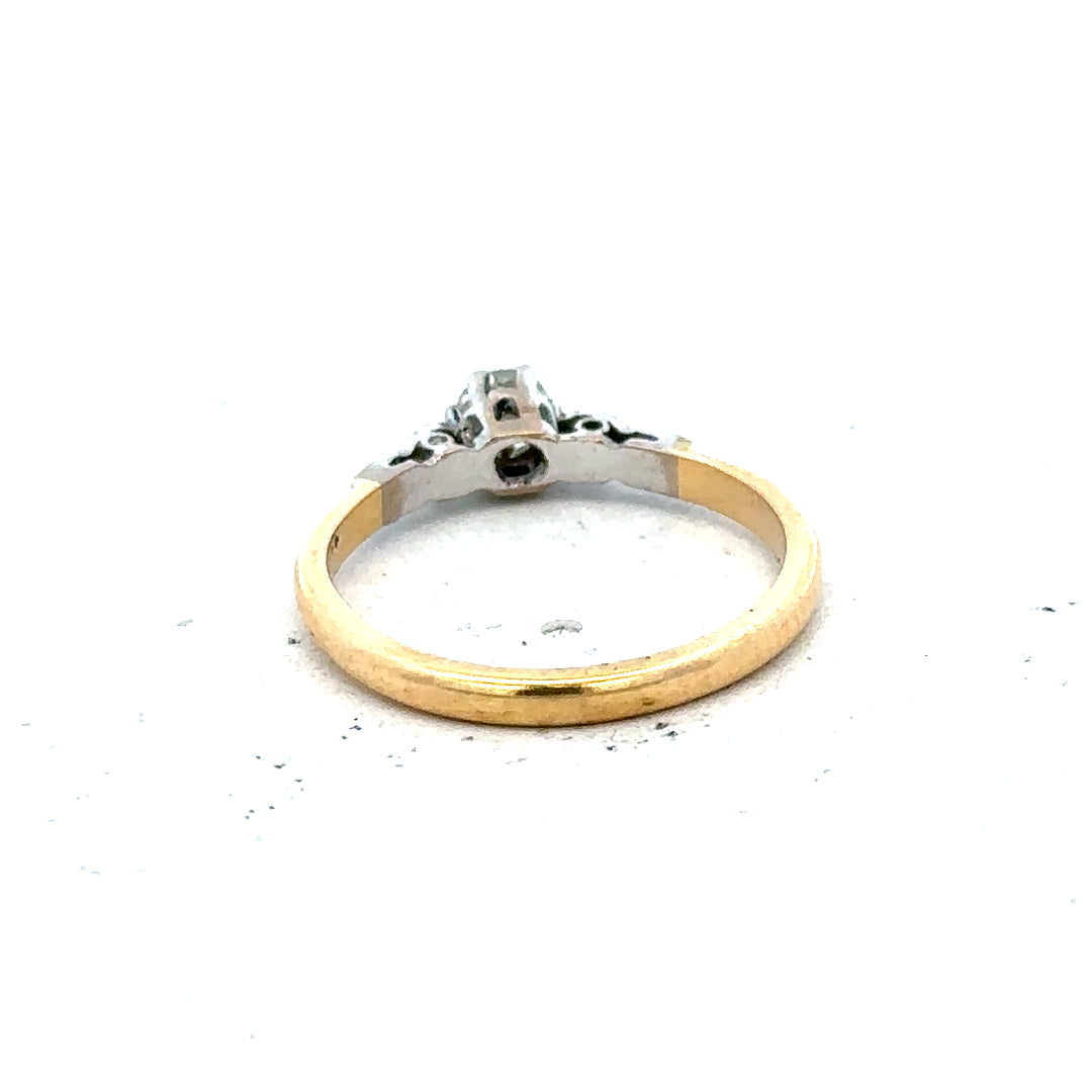 18ct yellow gold and platinum diamond ring, size M, featuring a detailed band with sparkling diamonds.