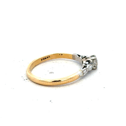 18ct yellow gold and platinum diamond ring, size M, featuring a sparkling diamond setting and a sleek band design.