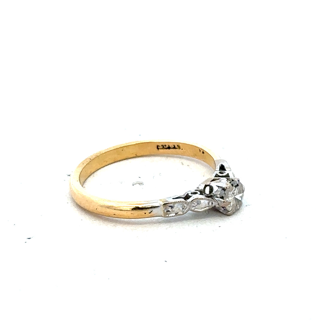 18ct yellow gold and platinum diamond ring, size M, showcasing a sparkling diamond design with a sleek band.