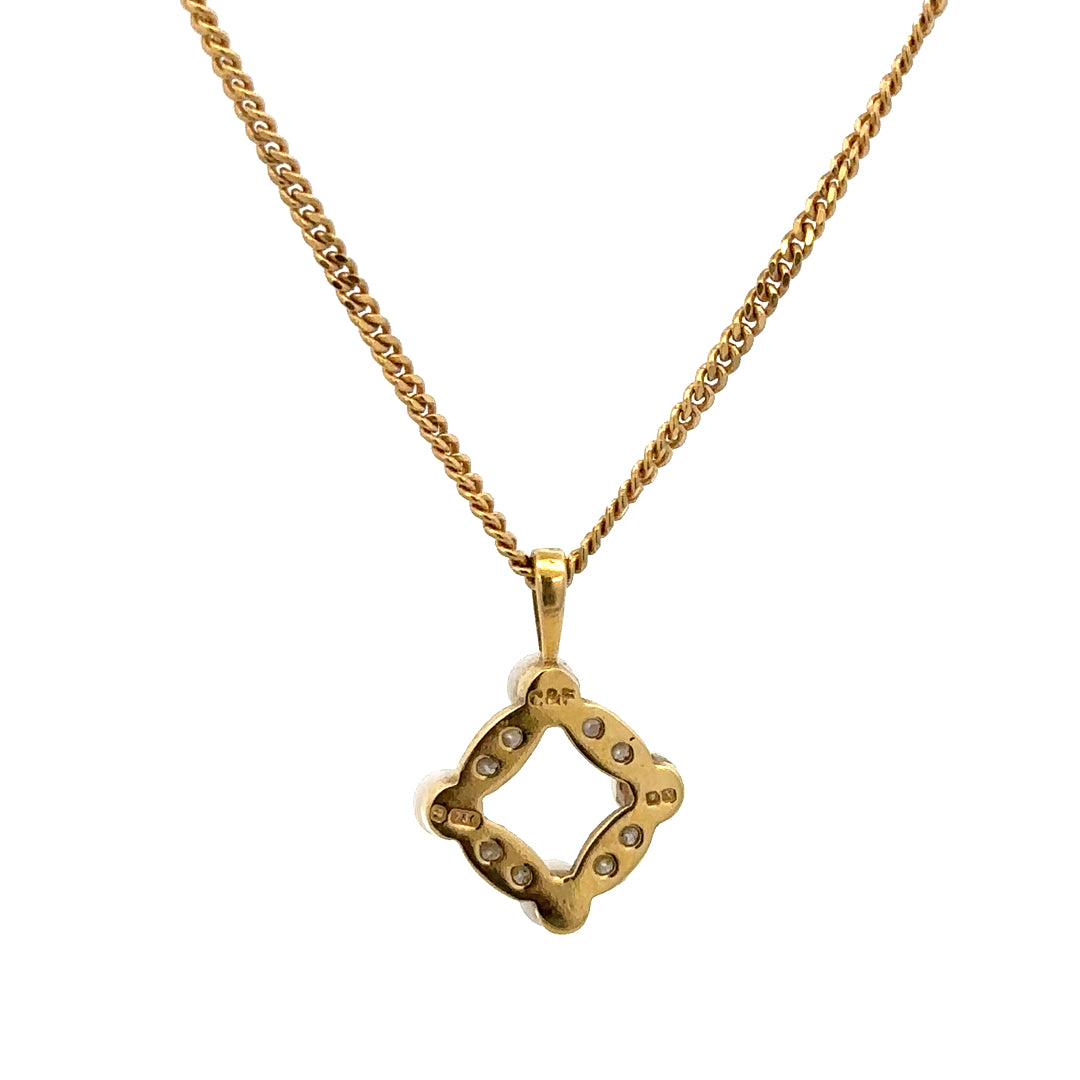 18ct yellow gold chain with pendant, unbranded, weighing 4.3 grams, featuring a detailed design visible in the image.