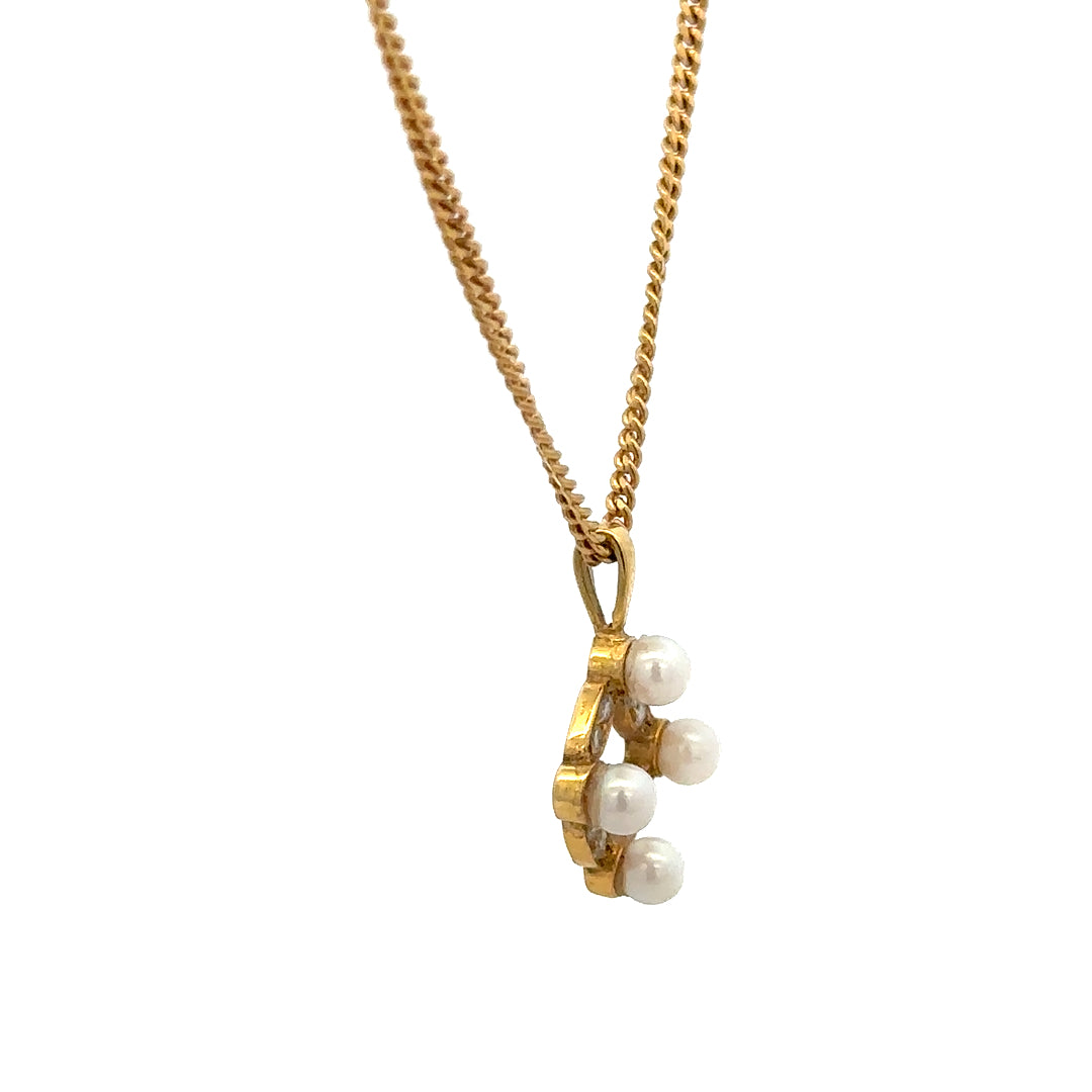 18ct yellow gold chain with pendant, unbranded, weighing 4.3g, featuring a detailed design visible in the image.