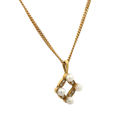 18ct yellow gold pendant with chain, unbranded, 4.3g, featuring a detailed gold design on a fine chain.