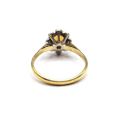 18ct yellow gold citrine and diamond ring with a central citrine gemstone and diamond accents, unbranded jewelry ring.