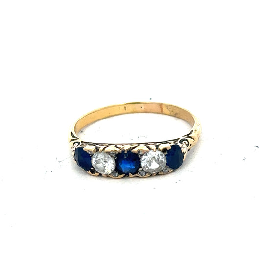 18ct yellow gold diamond and sapphire ring in size O 1/2, featuring a polished band with sparkling gemstones.