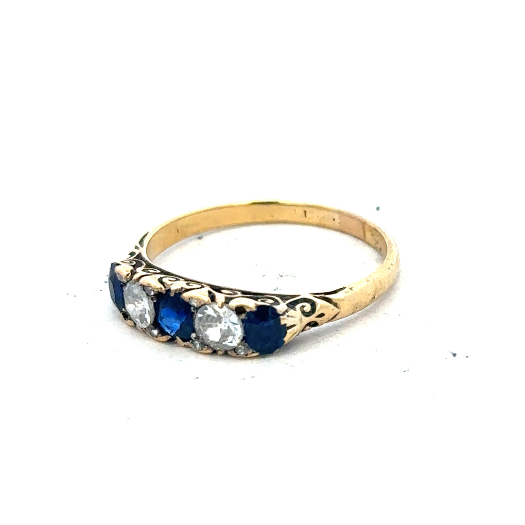 18ct yellow gold diamond and sapphire ring, size O 1/2, featuring sparkling stones and elegant design.
