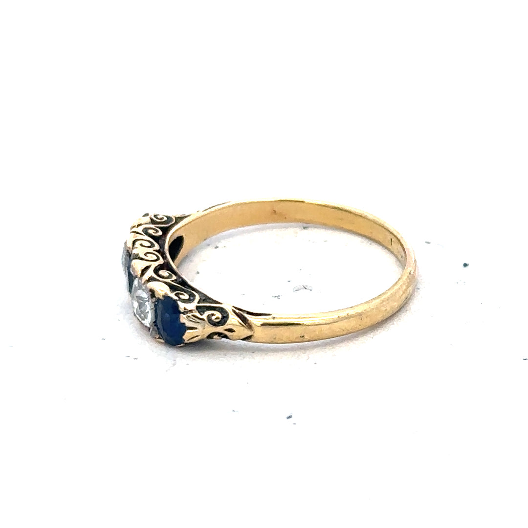 18ct yellow gold diamond and sapphire ring in size O 1/2, featuring a detailed design with sparkling stones.