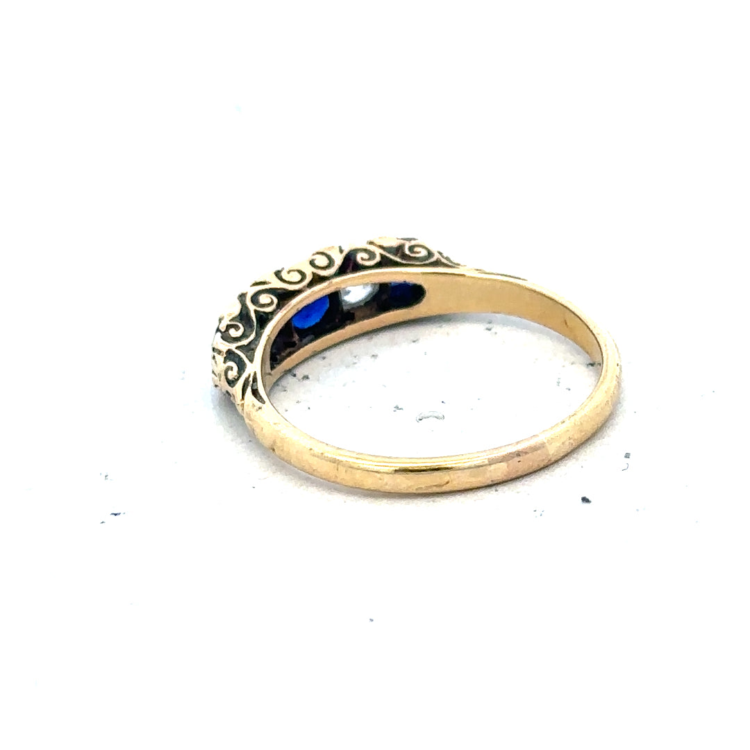 18ct yellow gold ring with diamonds and sapphires, size O 1/2, featuring a detailed gemstone design.
