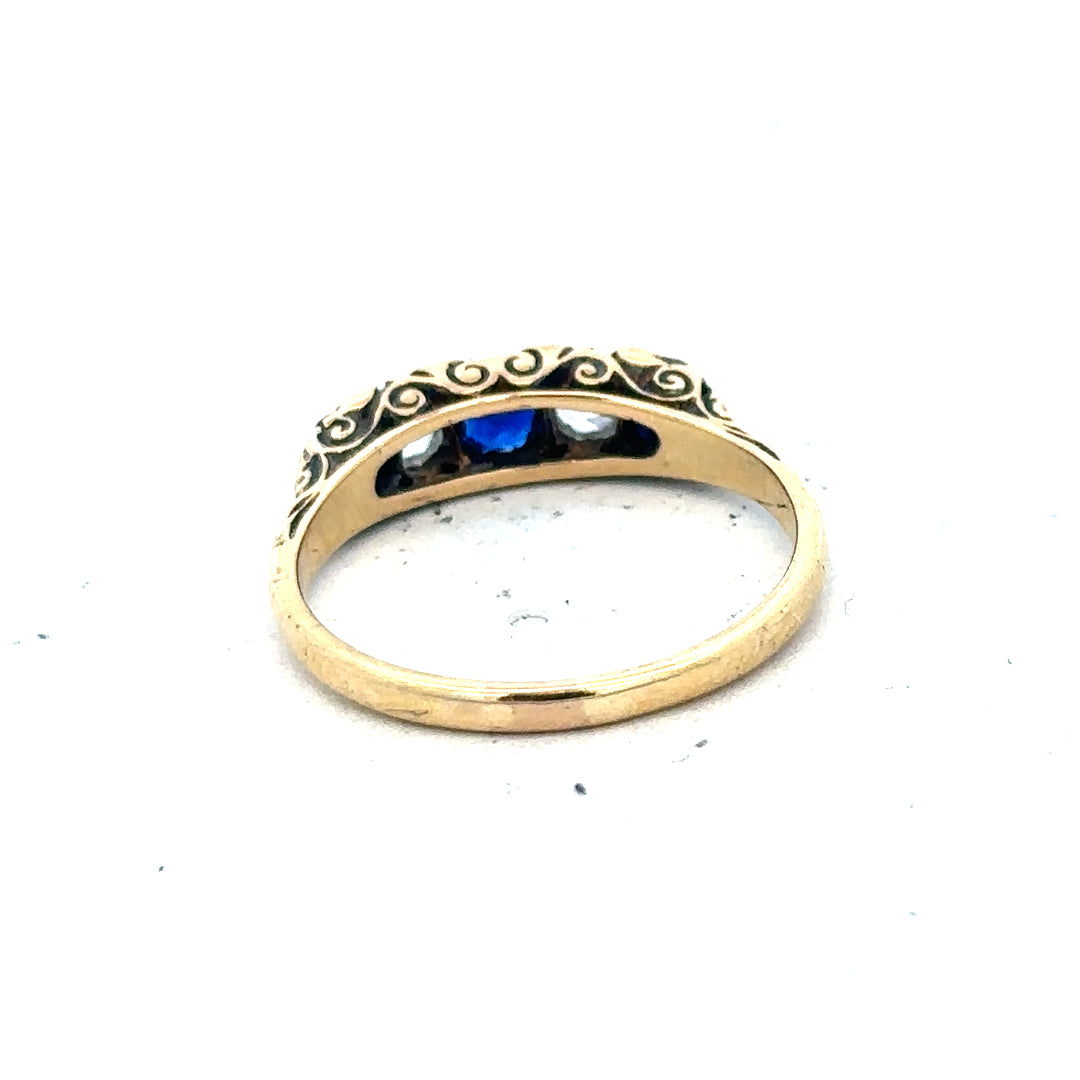 18ct yellow gold diamond and sapphire ring in size O 1/2, featuring a detailed design with sparkling gemstones.