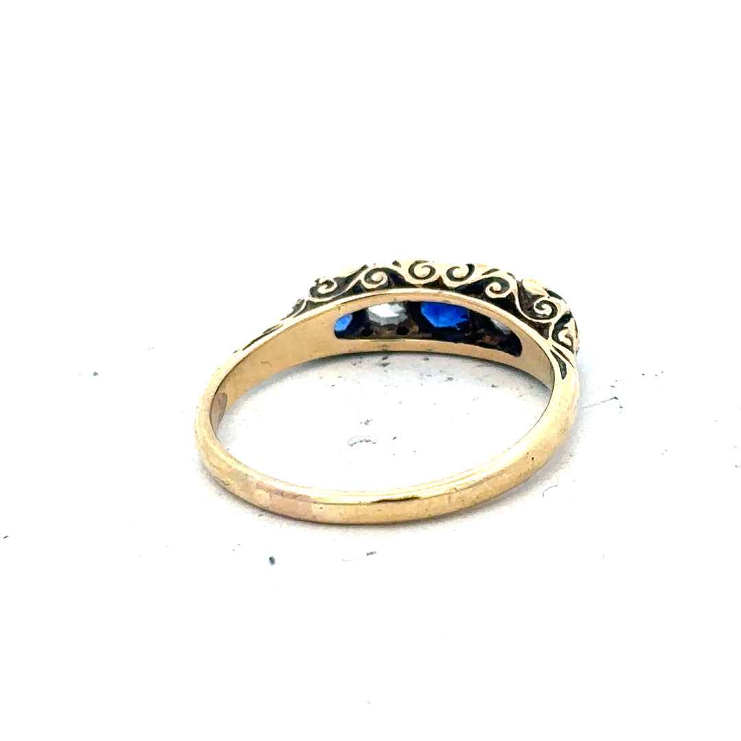 18ct yellow gold diamond and sapphire ring in size O 1/2, featuring sparkling stones and elegant design.