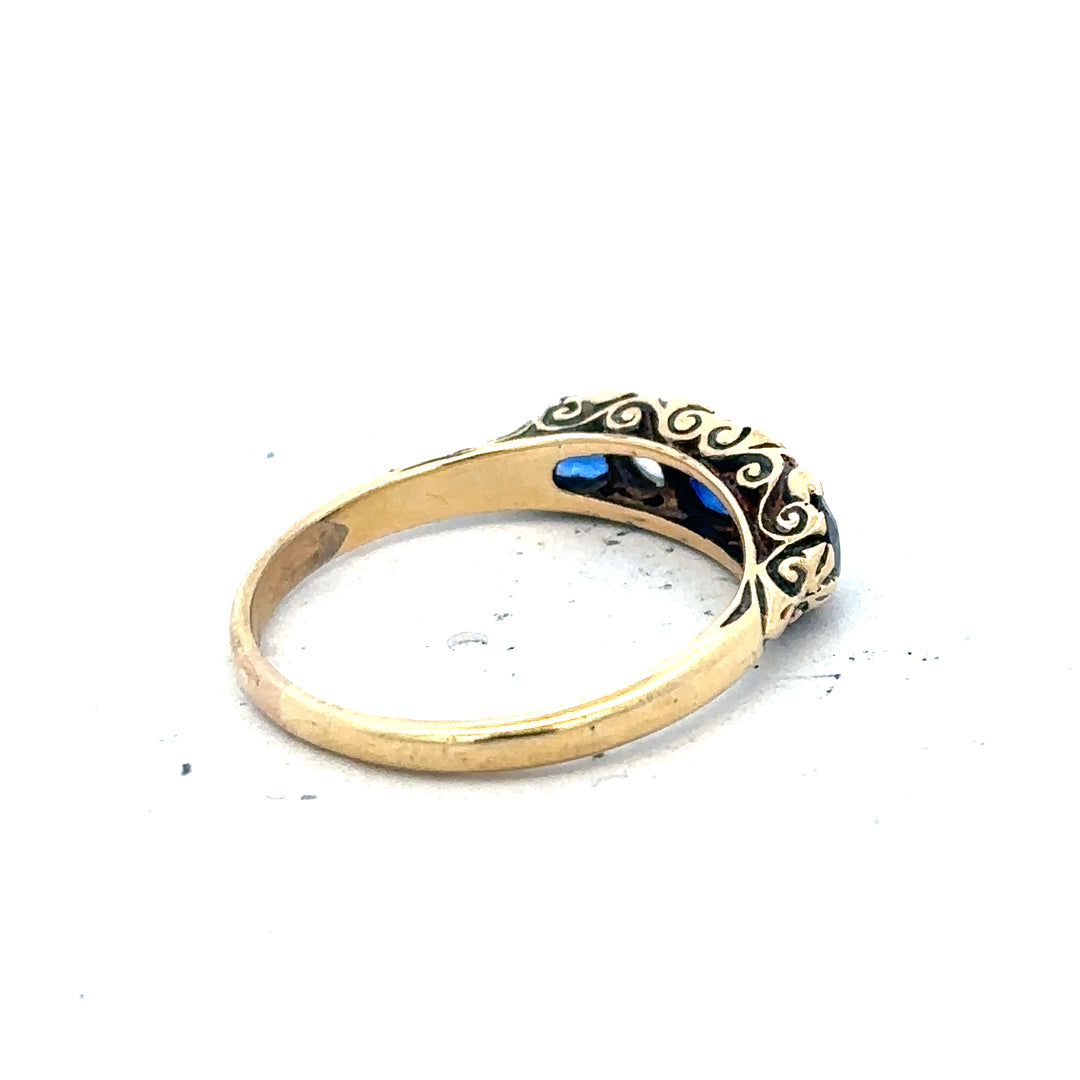 18ct yellow gold diamond and sapphire ring in size O 1/2, featuring a sparkling gemstone design on a sleek band.
