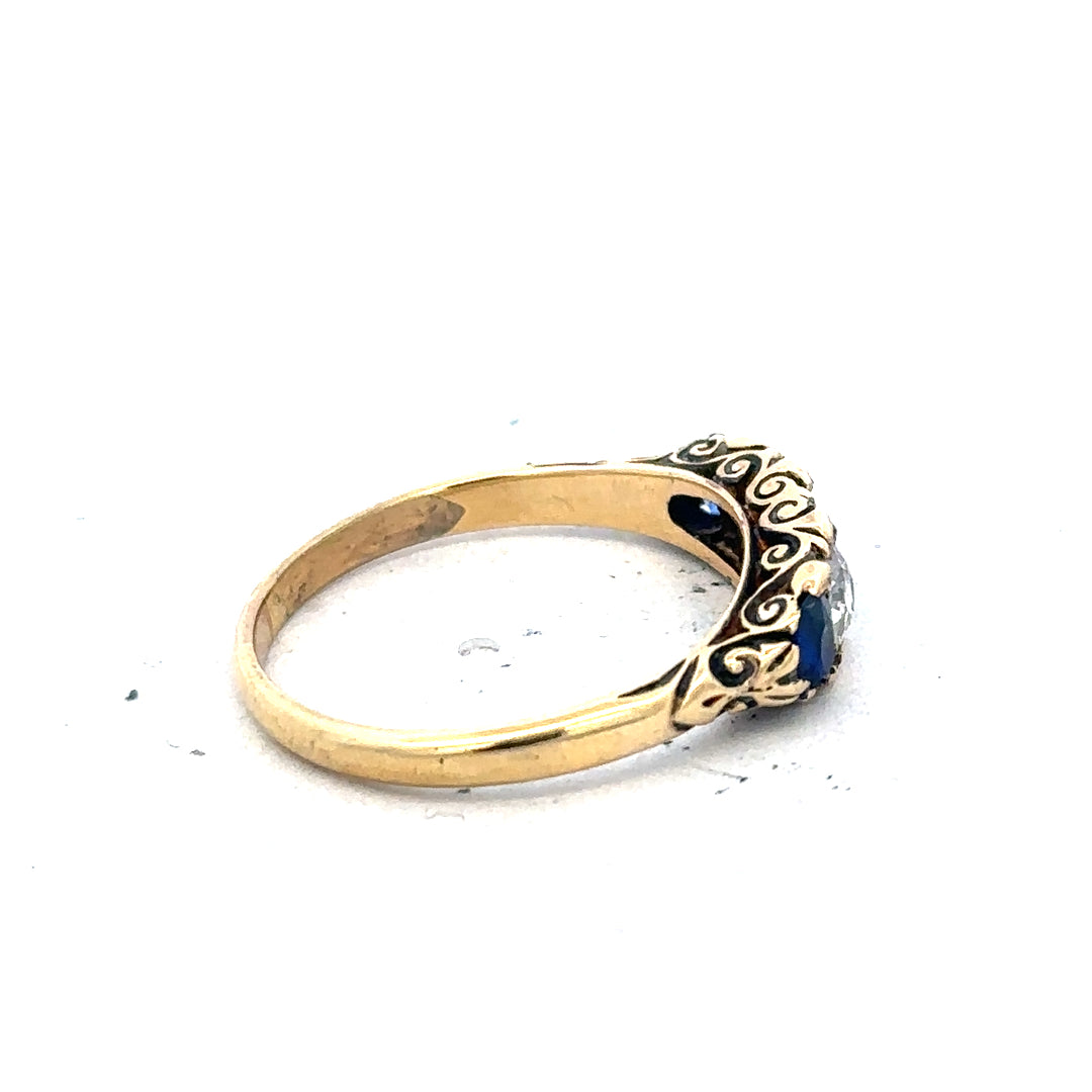 18ct yellow gold diamond and sapphire ring, size O 1/2, featuring a detailed design with sparkling gemstones.