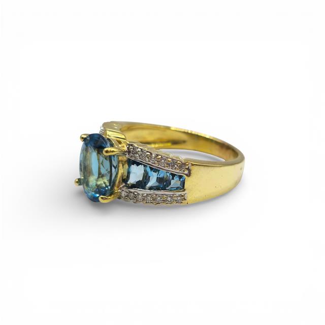 18ct yellow gold diamond and topaz ring with a detailed design, featuring sparkling diamonds and vibrant topaz stones.